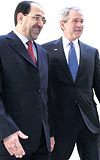 N. El Maliki G. W. Bush YEN HKMET DESTEK ALDI... Air Force Onela Iraka giden gazeteciler, elik yelek ve kask giydi. Bakan Bushun son ziyareti, Yeni Irak hkmetine destek olarak yorumland. 